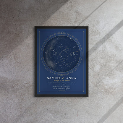 Framed canvas print of a night sky chart in a black floating frame, names Samuel and Anna, hung on a concrete wall