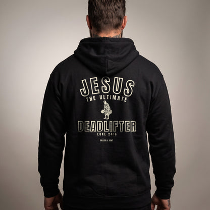 Jesus the Ultimate Deadlifter Christian hoodie, Black, worn by a man, back view, Luke 24:6 varsity print with Called and Sent sign-off
