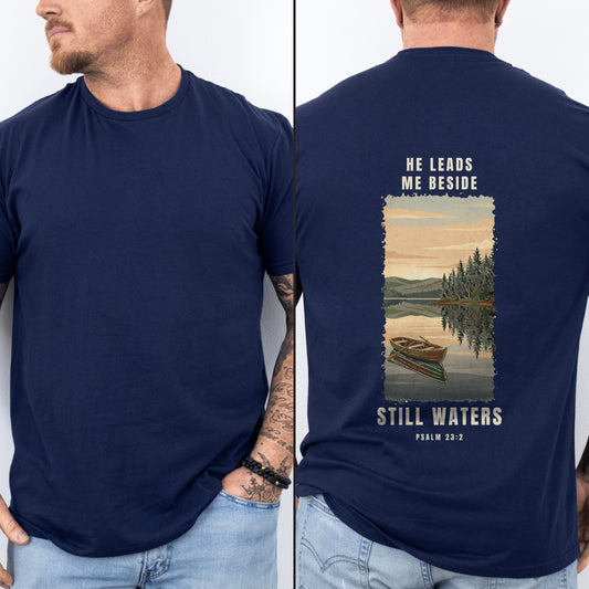 He Leads Me Beside Still Waters Christian fishing shirt, Navy, worn by a man, dawn lake poster back print, Psalm 23:2