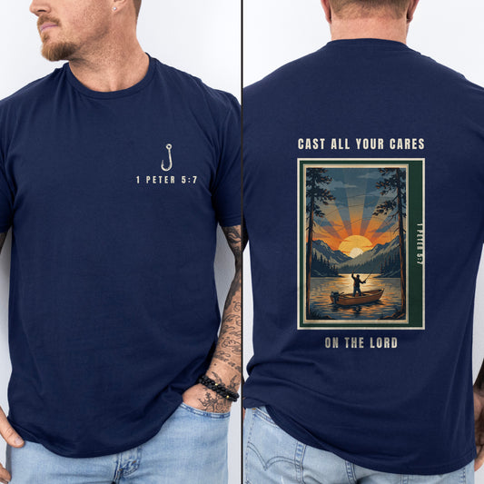 Cast All Your Cares On The Lord shirt in Navy, front and back on a male model, fisherman-at-dawn poster back print with fish-hook cross chest badge, 1 Peter 5:7