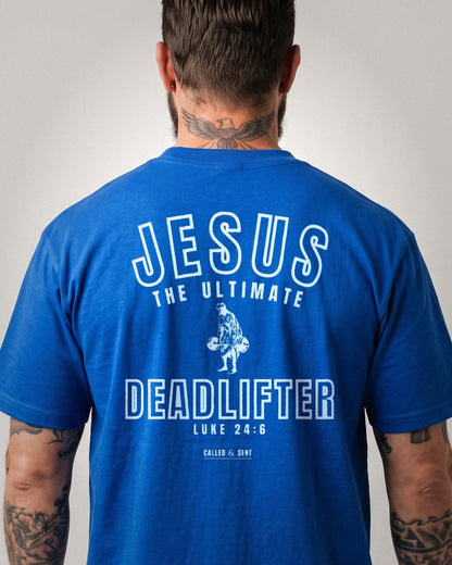 Jesus The Ultimate Deadlifter heavyweight tee, Royal Blue, 6 oz Ultra Cotton boxy classic cut, plain front and white ink JESUS THE ULTIMATE DEADLIFTER back print, Luke 24:6