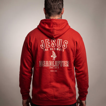 Jesus the Ultimate Deadlifter Christian hoodie, Red, worn by a man, back view, Luke 24:6 back print