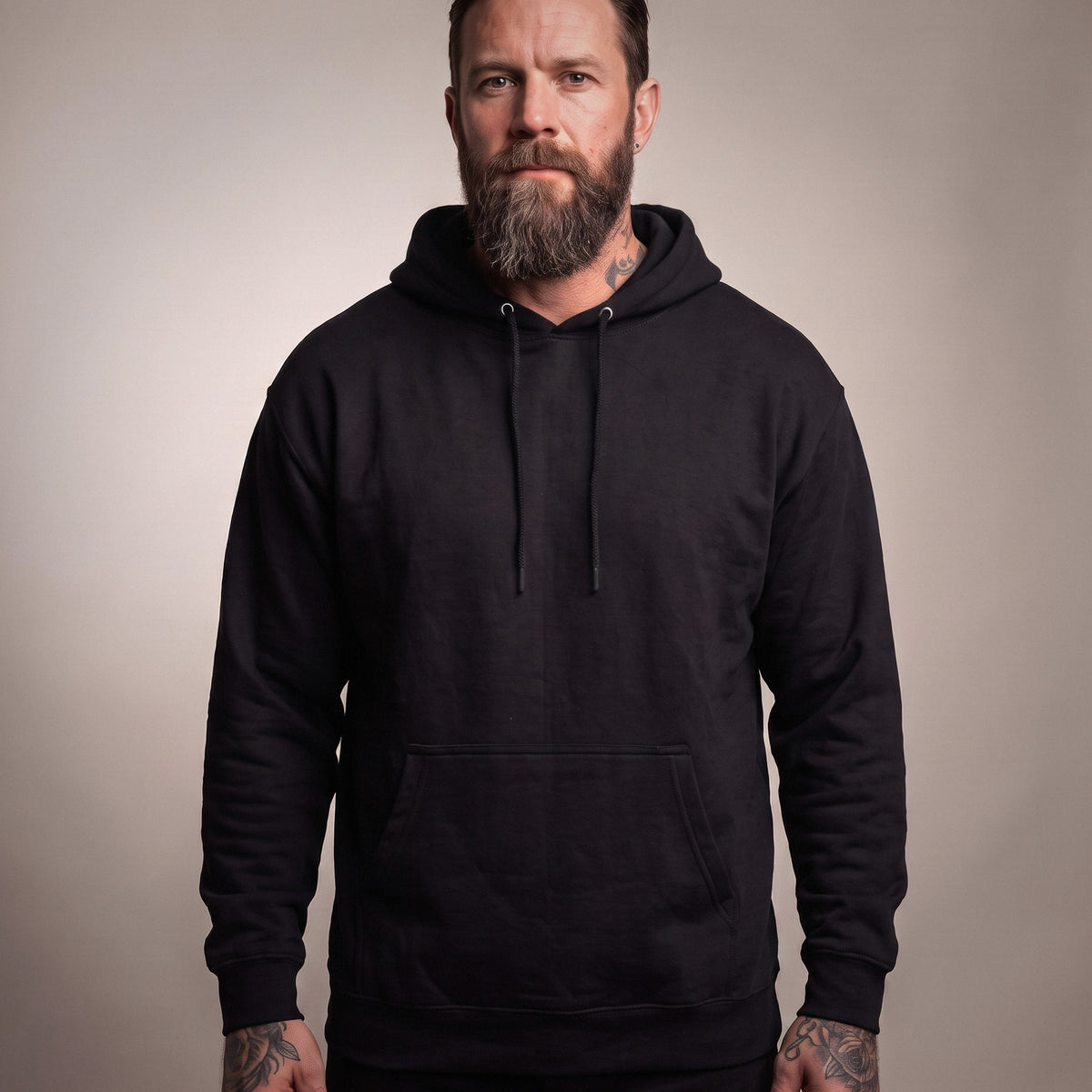 Front view of the blank Black hoodie; the Jesus the Ultimate Deadlifter design prints on the back