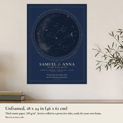 The unframed 18 x 24 in Covenant print at true scale on a wall above a wooden sideboard, thick matte paper, rolled in a protective tube