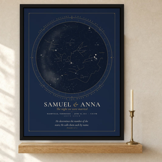 Framed canvas print of a night sky chart in a black floating frame, names Samuel and Anna, The night we were married, Nashville, Tennessee, hung on a cream wall above an oak shelf with a brass candlestick